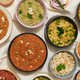 Overhead shot of Indian dishes on table